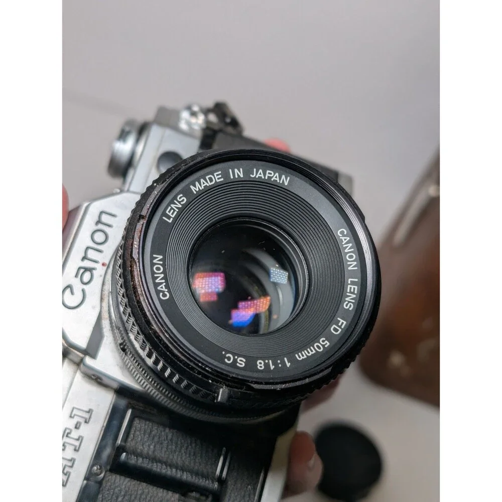 Canon AT-1 35mm Film Camera + 50mm f/1.8 Lens and Vivitar 75-205mm f/3.8 lens